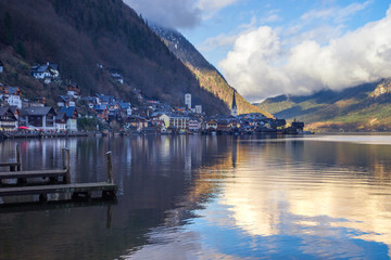 Fototapeta na wymiar Hallstatt, a charming village on the Hallstattersee lake and a famous tourist attraction, with beautiful mountains surrounding it, in Salzkammergut region, Austria, in winter sunny day.