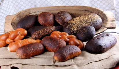 Fresh collection of bread and wheat on the table. Collection of different types of bread: White, rye, seed, form bread. lots of photos of bread with rye ears