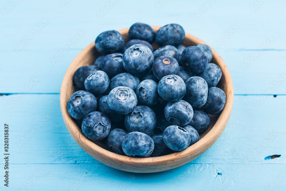 Canvas Prints Fresh organic blueberries in wooden bowl