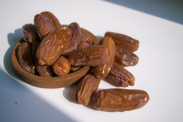 dried dates palm on white background