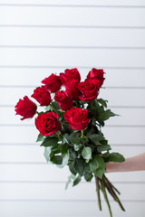 Beautiful bouquet of mixed flowers with roses. The work of the florist. Flower delivery