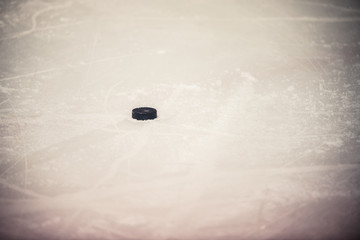 Ice hockey puck on the ice
