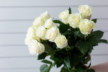 Beautiful bouquet of mixed flowers with roses. The work of the florist. Flower delivery