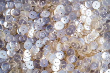 a lot of pearl white plastic buttons