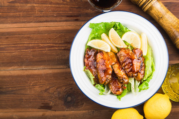 Cola chicken wings on plate