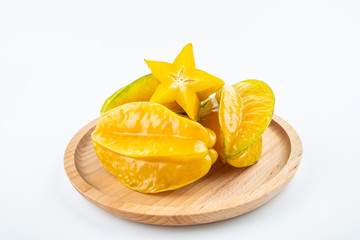 Fresh fruits carambola and pulp slices on white background