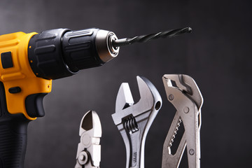  hardware tools including cordless drill and monkey spanner