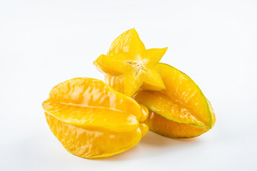 Fresh fruits carambola and pulp slices on white background