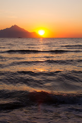 Obraz premium waves, sunset on the beach, part of the sea