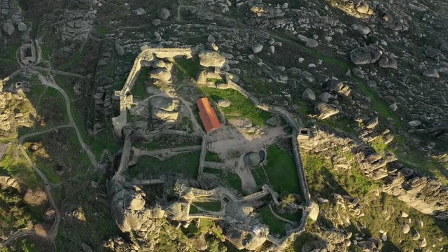 A collection of aerial views over Monsanto. Aldeia de Monsanto, is a historic village among granite cliff. Aerial view of the Castle.