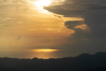 Fototapeta na wymiar A ship sailing off the west coast of Costa Rica under a dramatic sky