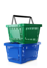 Fototapeta premium Color plastic shopping baskets isolated on white