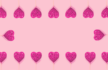 Abstract composition with decorative hearts on pink paper background. Valentine day theme.