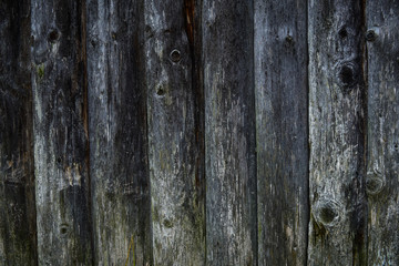 Old wooden boards on the wall of a house