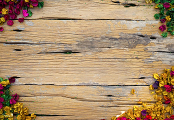 Dried flowers on old wooden plates. Top view point.