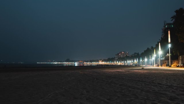 Timelapse of dusk falling over Juhu beach Mumbai