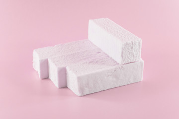 Sweet pink marshmallow rectangular shape in the form of a geometric shape. Marshmallows with the taste of cranberries, strawberries or other berries