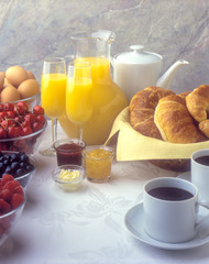 Brunch Ingredients, jam, marmalade, coffee, croissant, eggs, cherries, blueberries, raspberries, butter, orange juice