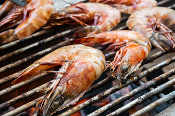 Grilled shrimps on the flaming grill.