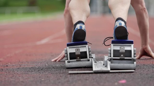 athlete in sprintstart in track and field