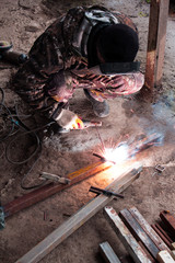 Welder at the moment of work with the welding machine