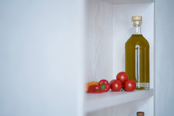 a bottle of healthy organic cooking oil on the wall shelf in mediterranean style with copy space