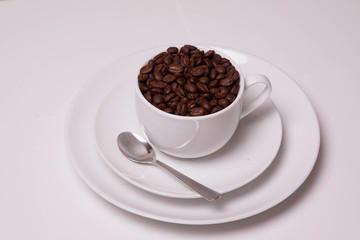 A Cup Full Of Coffee Beans