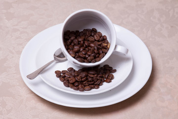 Coffee Beans Spilling From A Cup