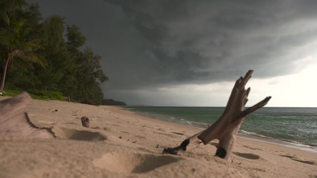 A Piece Of Old Wood Entrenched On A Fine White Sand Under A Beautiful Cloudscape - Medium Shot