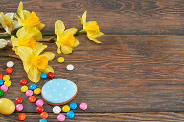 Easter glazed cookies, chocolate balls and daffodils.