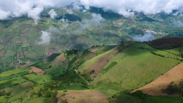Aerial View of Green Hills Under Fluffy Clouds in Zona Cafetera, Coffe Farming Region in Colombia