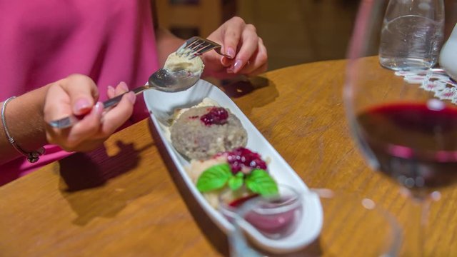 Close up dessert at restaurant, Caucasian female hands putting dessert on spoon, Static shot