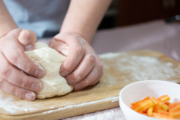 Knead the dough on a wooden board