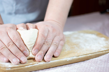 Knead the dough on a wooden board