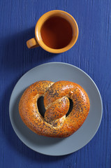 Poppy pretzel and tea cup