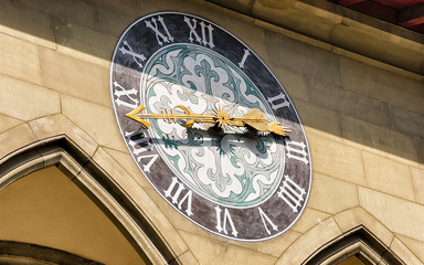 Clock as a fragment of outdoor decor at City hall building in Bern, Bern-Mittelland district, Switzerland. Mixed media.