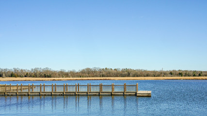 Fototapeta na wymiar Boat dock on a lake on a clear day.