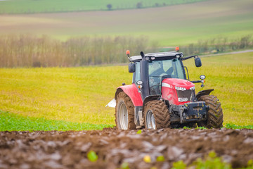 farmer plowing his fields in early spring