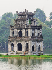 Fototapeta premium View of the Tourist Tower in the Hoan Kiem Lake in Hanoi, Vietnam