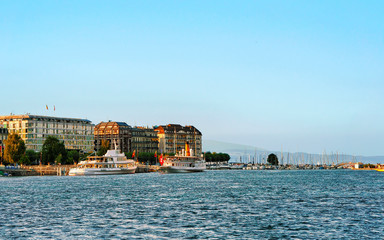 Ships in Geneva Lake near Quai du Mont-Blanc in summer, at Geneva in Switzerland. Mixed media.