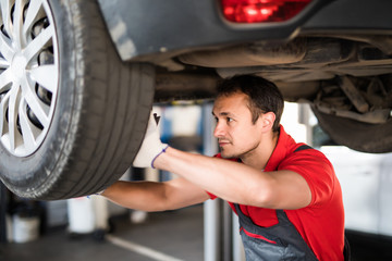 Handsome man mechanic with tool checking the car © F8  \ Suport Ukraine