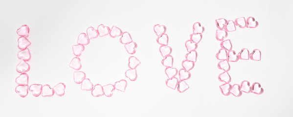 valentines day design pattern with love word made by hearts, selective focus.