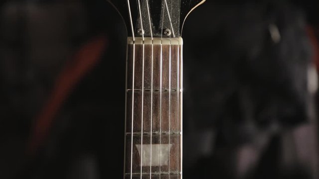 Close Up Of A New Acoustic Guitar From Head Down To The Bridge - Close Up Shot