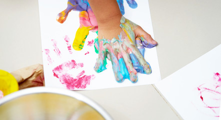 Obraz na płótnie Canvas Colorful hand print on canvas with fun art work
