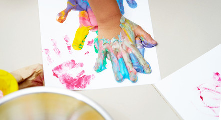Colorful hand print on canvas with fun art work