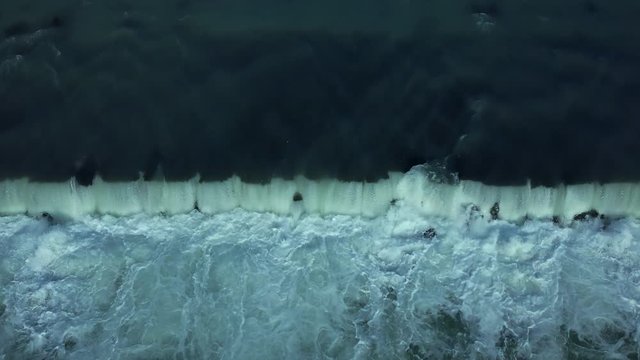Aerial flying along the Adda river, a tributary of the Po, that flows into Lake Como, North Italy. Drone overhead slow dolly back and up to wide shot