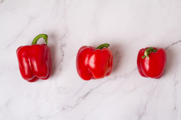 several red peppers on a white background