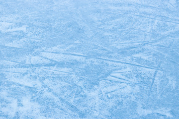 Abstract ice texture. Nature blue background. Traces of blades of skates on ice