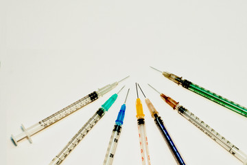 Medical syringes. Injection syringes and vaccines. Syringe with a needle. The concept of health,...
