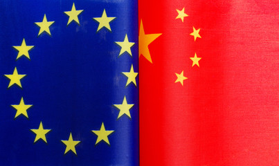 fragments of European Union and Chinese flags in close-up